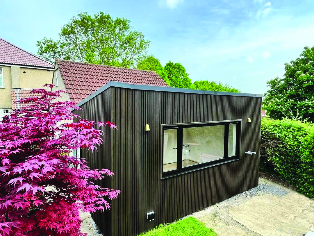 Composite Cladding Boards used on a contemporary café to both clad the walls and create an outside seating area for customers to sit and relax.