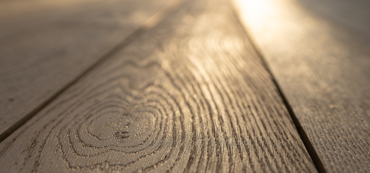 Close-up of Millboard® Enhanced Grain limed oak decking board with realistic oak woodgrain texture