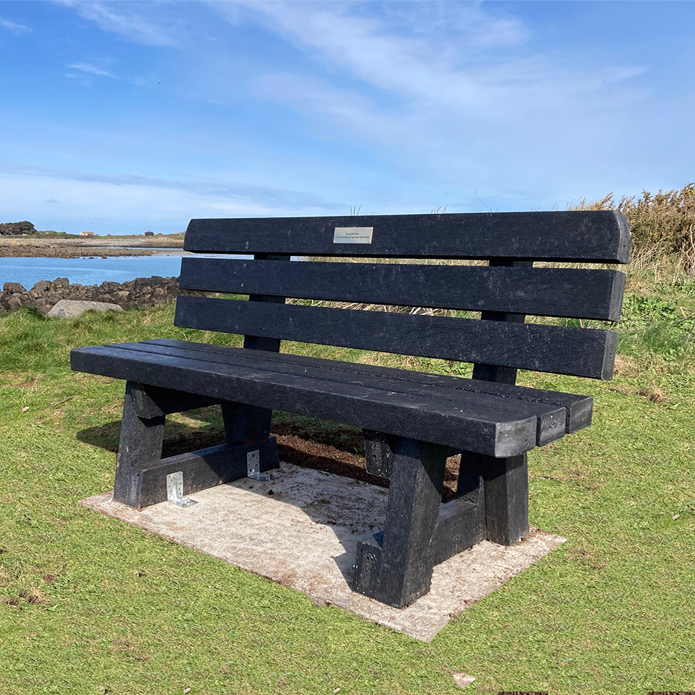 Recycled plastic bench installed looking out to sea.