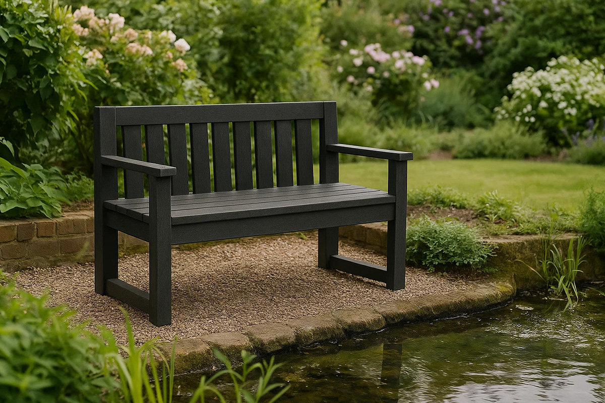 Traditional style recycled plastic bench next to a garden pond.