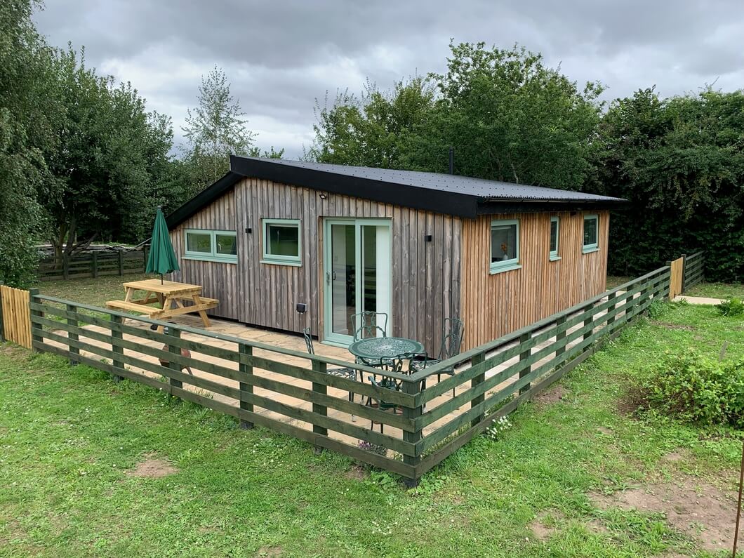 Holiday lodge with black Corrugated Roofing Sheets