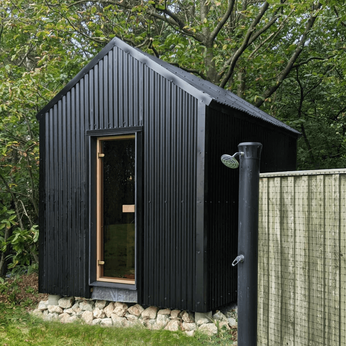 Cladco black 13/3 corrugated metal sheets used on a small garden sauna