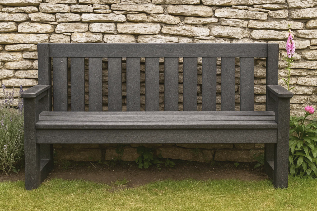 Black recycled plastic garden bench against a stone wall, ideal for low-maintenance outdoor seating.