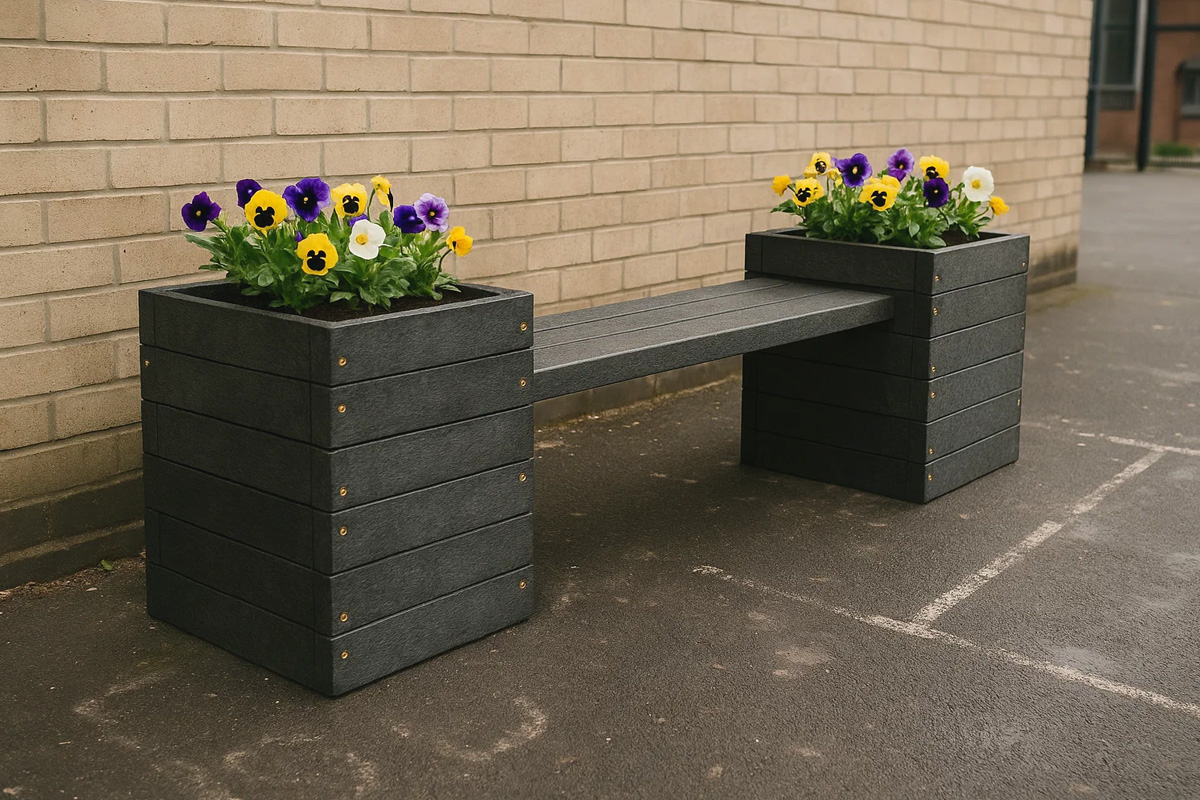 Recycled plastic bench with built-in flower planters outside a school, showing creative and eco-friendly outdoor seating solutions.